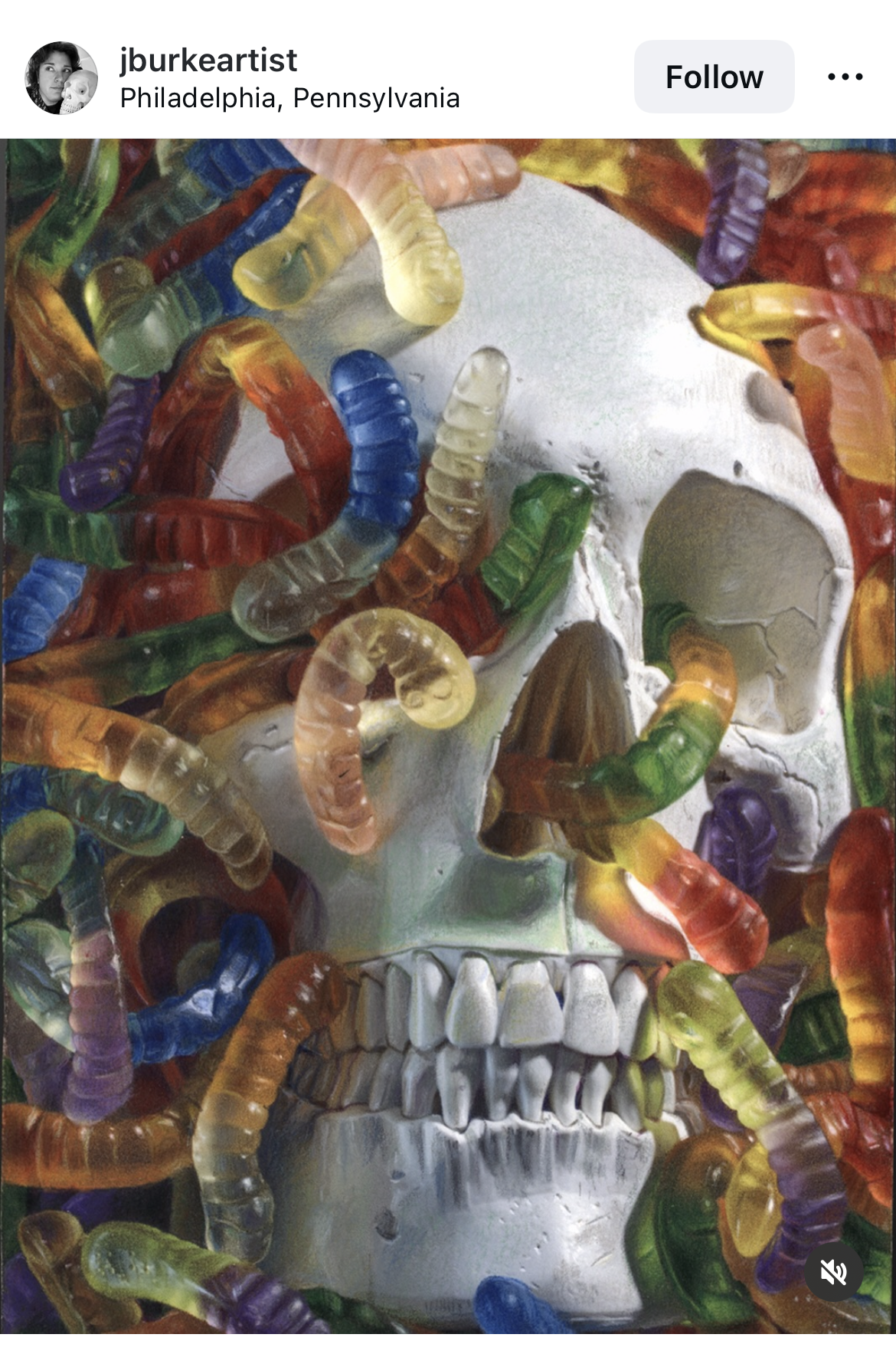 Gummy worms crawling around and eating a skull like snakes.